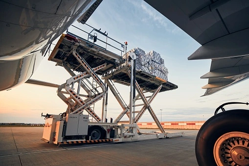 Air parcel cargo being loaded onto a plane for international shipping from Calgary, Canada to Denmark, Europe